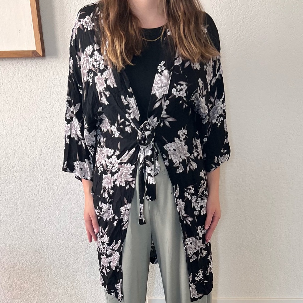 This is a black floral robe perfect to use as a swim suit cover